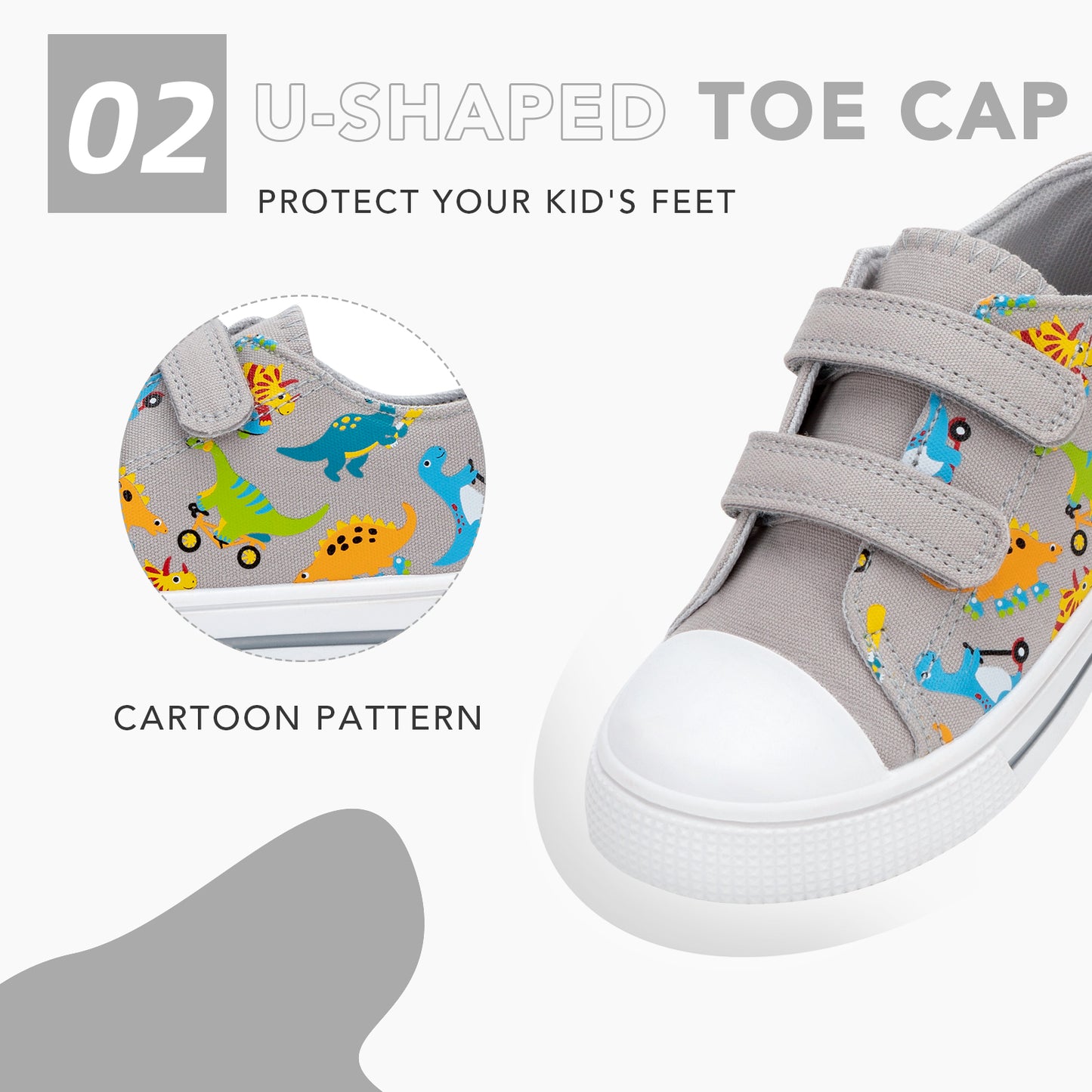 gray children's sneakers with cartoon dinosaur pattern and u-shaped toe cap feature.