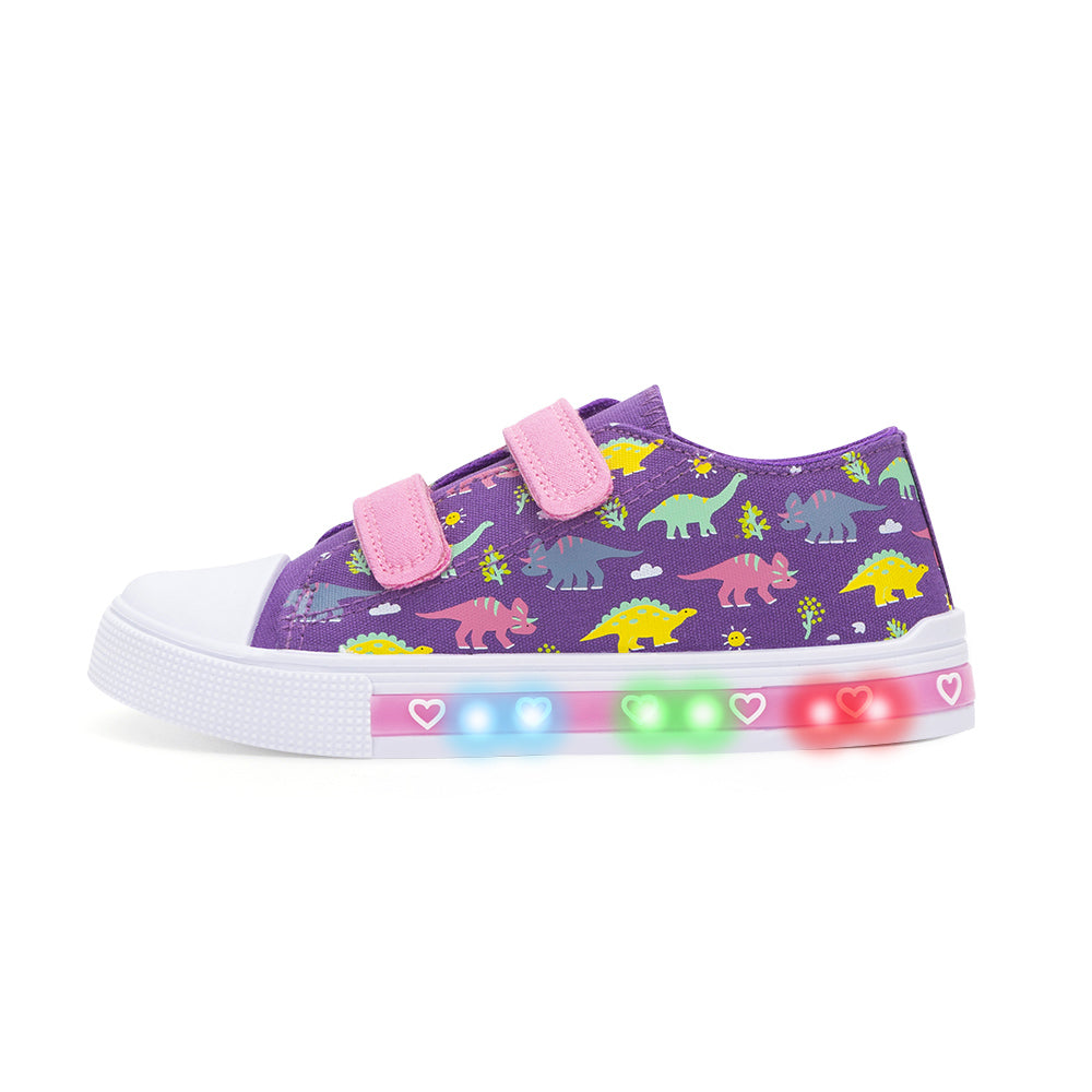Purple children's sneakers with dinosaur pattern and LED lights on a white background