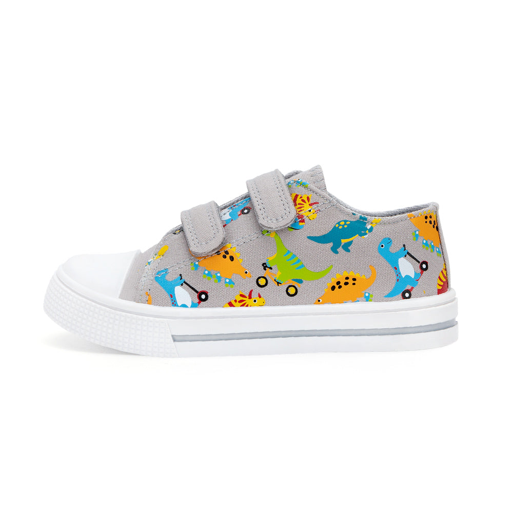 Gray children's shoe with colorful dinosaur pattern on a white background