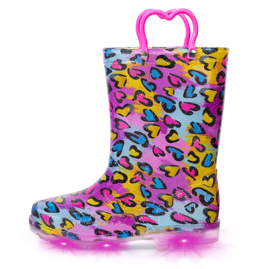 Colorful heart-patterned rain boot with pink handle on a white background