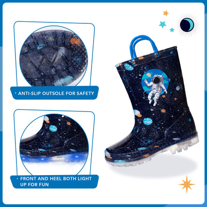 Space-themed rain boot with astronaut design, anti-slip sole, and light-up feature on a blue background.