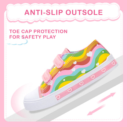 Colorful children's shoe with rainbow pattern on a pink background
