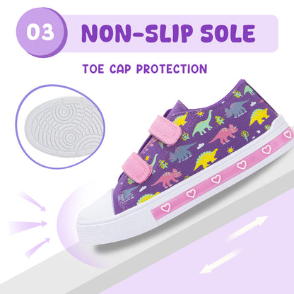 Purple children's sneakers with dinosaur pattern and pink velcro straps on a light purple background.