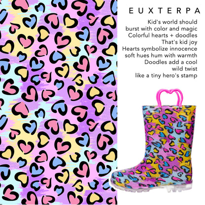 Colorful rain boot with heart and doodle pattern next to text about the product's design and meaning.